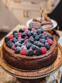 224107478-a-selective-focus-shot-of-a-tasty-homemade-cheesecake-with-blackberries-and-raspberr...jpg