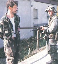 A Serbian fighter and a captured Croatian soldier. Operation Corridor, 1992..jpg