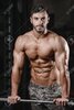 67766428-strong-and-handsome-athletic-young-man-with-muscles-abs-and-biceps-close-up-of-a-powe...jpg