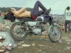 5579489_b~Shirtless-Man-in-Levi-Strauss-Jeans-Lying-on-Motorcycle-Seat-at-Woodstock-Music-Festiv.jpg